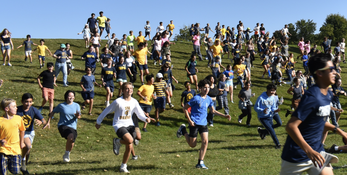 ADRENALINE. Students try not to get trampled as they run next to friends or by themselves as they follow the rest of the crowd.